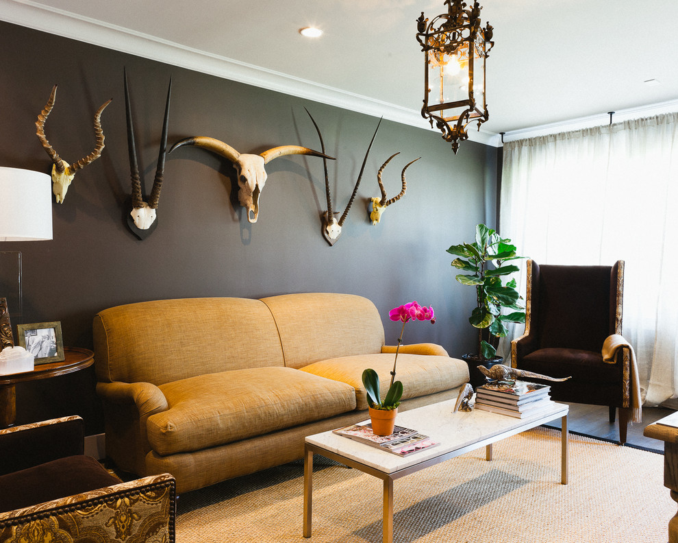 Sumptuous-Cow-Skull-convention-Houston-Eclectic-Living-Room-Decorating-ideas-with-armchair-black-black-wall-coffee-table-dark-painted-wall-lantern-plant-side-table-sisal